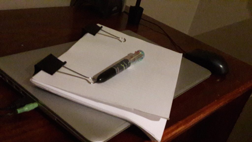 Post-apocalyptic novel manuscript with awesome pen.